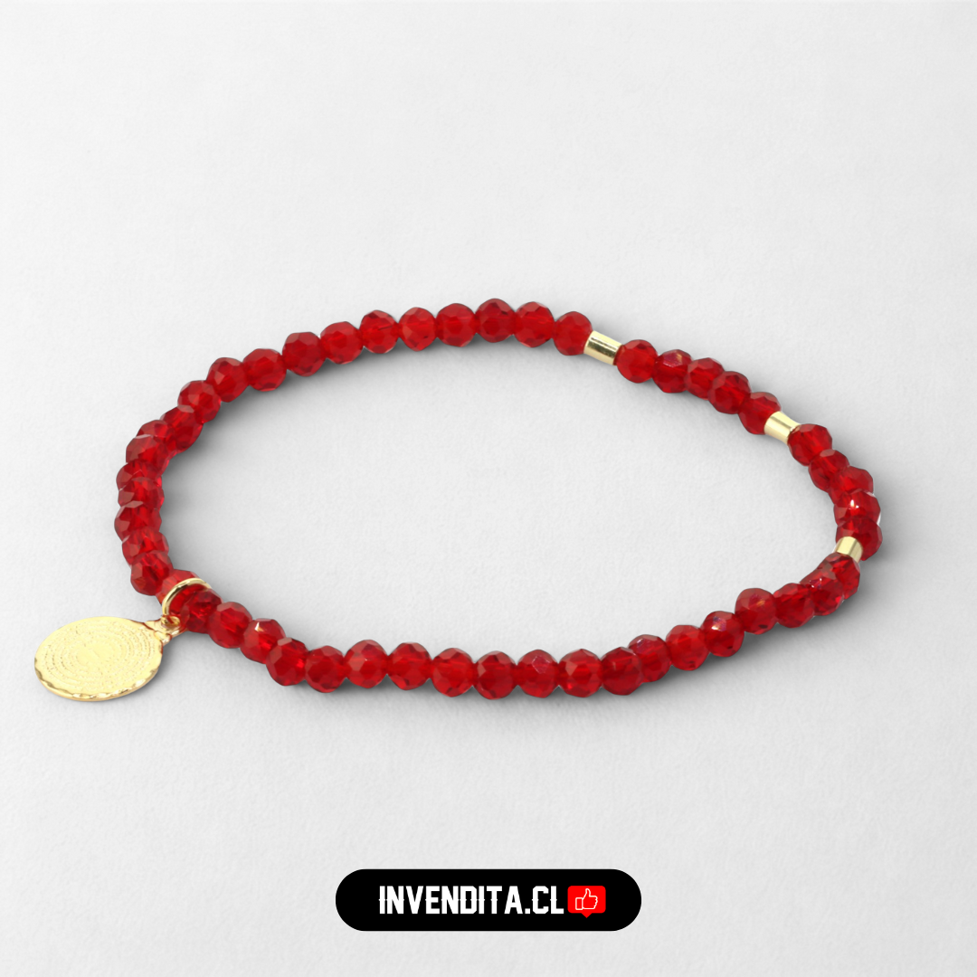 Pulsera enchapada en oro cristales rojos con terminales dorados y placa de Padre Nuestro