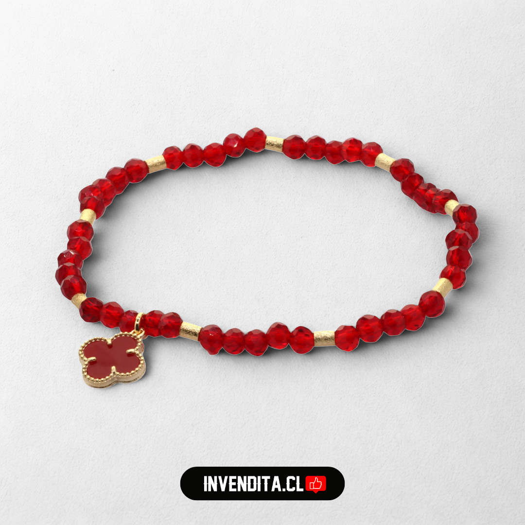 Pulsera enchapada en oro cristales rojos y dije de flor
