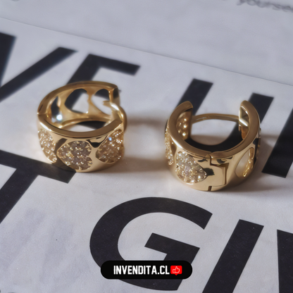 Aros enchapados en oro argolla con circones y corazones