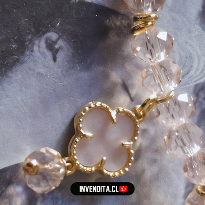 Pulsera enchapada en oro terminales dorados con cristales rosas y dije de flor